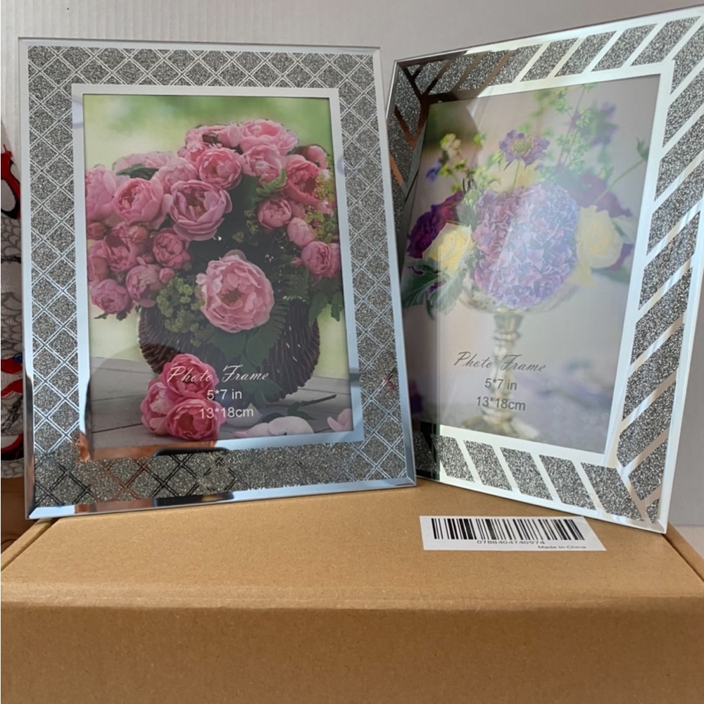 2 silver, glass picture frames